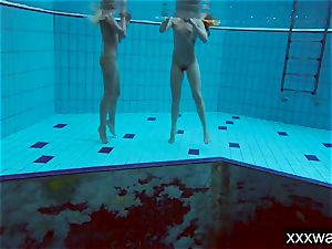 sizzling Russian women swimming in the pool